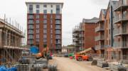 UK build-to-rent blocks beside a quiet construction site