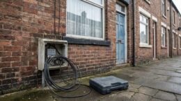 Terraced rental house with open electrical meter box