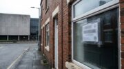 English rental home with unmarked rent notice near civic building
