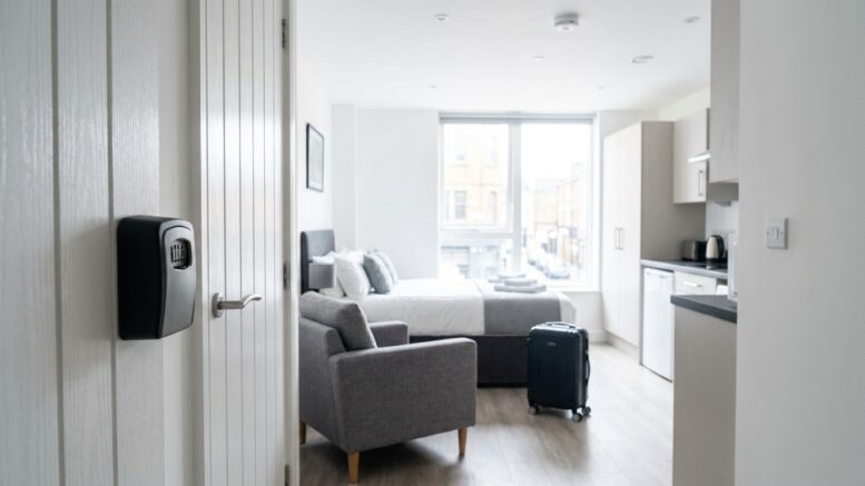 Guest-ready UK city apartment with suitcase and key safe