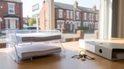 UK lettings paperwork trays with keys on a desk