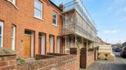 Converted Victorian flats with retrofit scaffolding in daylight