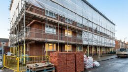 Cladding remediation scaffolding on UK flats in daylight