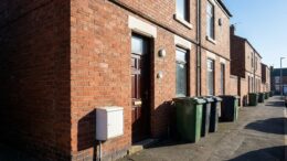Terraced HMO house with gas meter box in daylight
