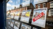 British estate agent window with sold property listings