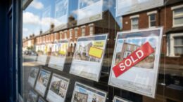British estate agent window with sold property listings