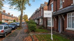 To Let board outside terraced rental homes as rents hit record